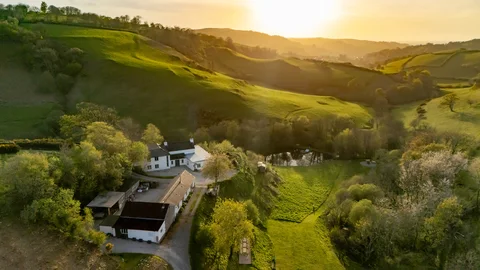 Lakeview Farmhouse and the surrounding valley in warm evening light