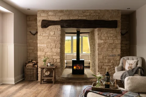 A wood-burning stove in the Farmhouse stone hearth
