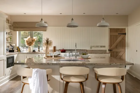 The Farmhouse breakfast island set with bowls and a vase of flowers