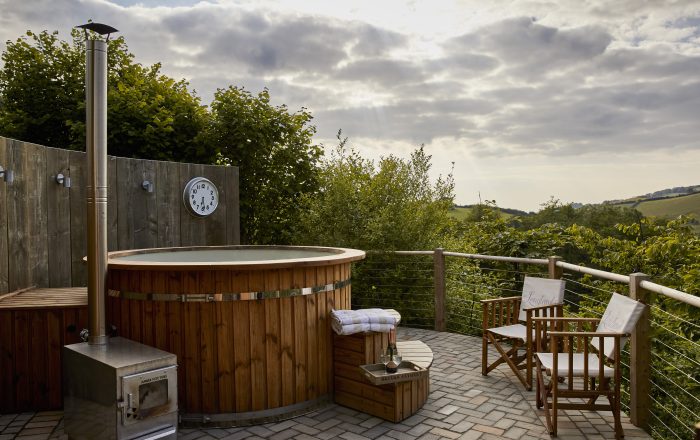 Hot tub with countryside views at Longlands Devon luxury glamping