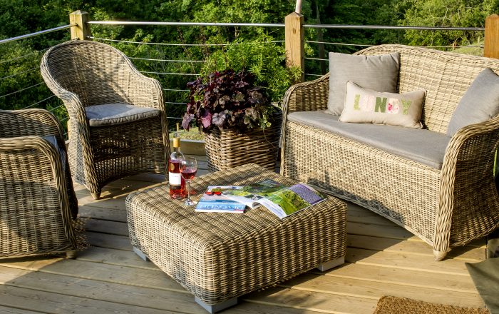 Comfortable seating area on private safari lodge deck at Longlands Devon