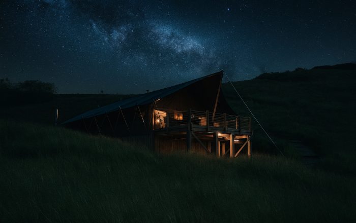 Safari lodge at night under the Milky Way at Longlands Devon luxury glamping